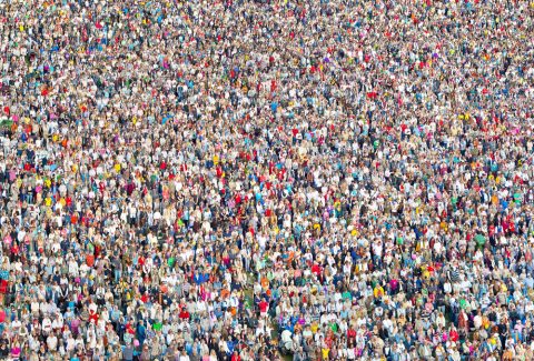 10635_a-large-crowd-standing-and-listening-to-a-concert2